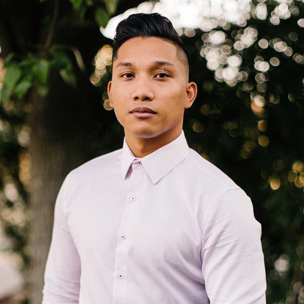 man wearing dress shirt with pants