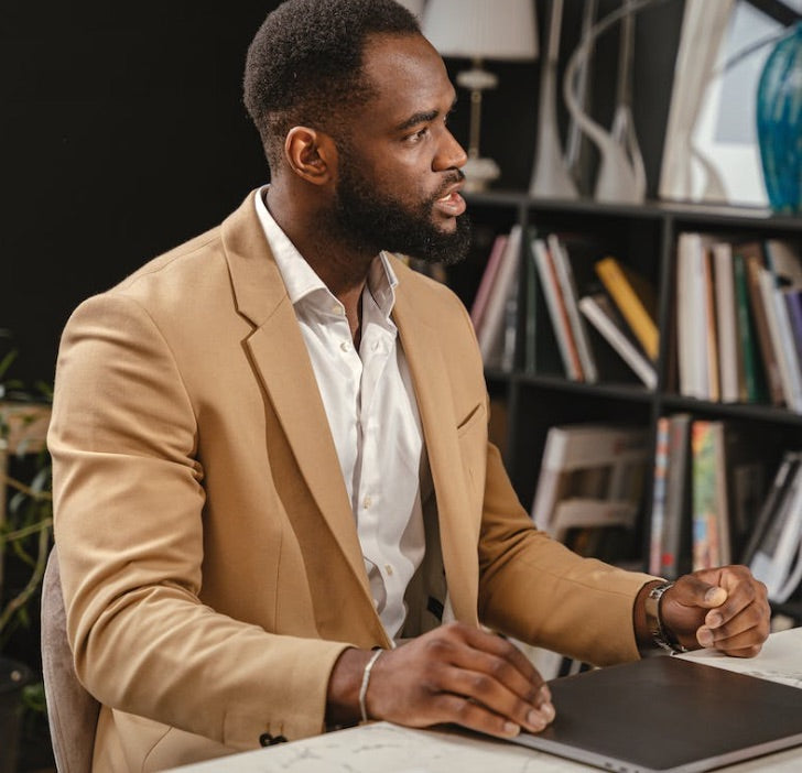 tan color suit on dark complexion man in business casual attire