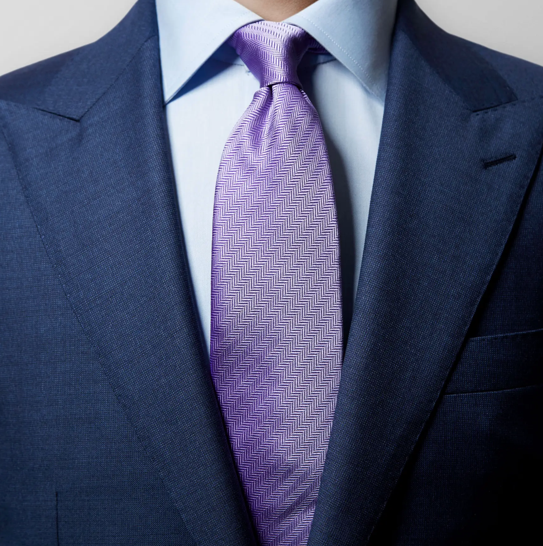 what color tie with navy suit: man wearing purple tie
