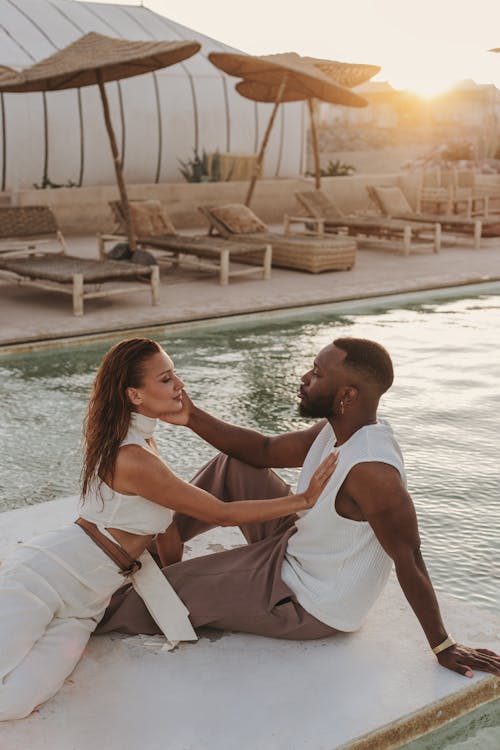 resort casual attire: couple by pool