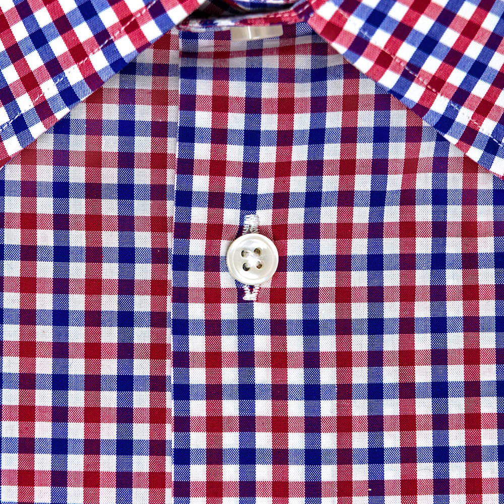 button on a red white and blue button up shirt