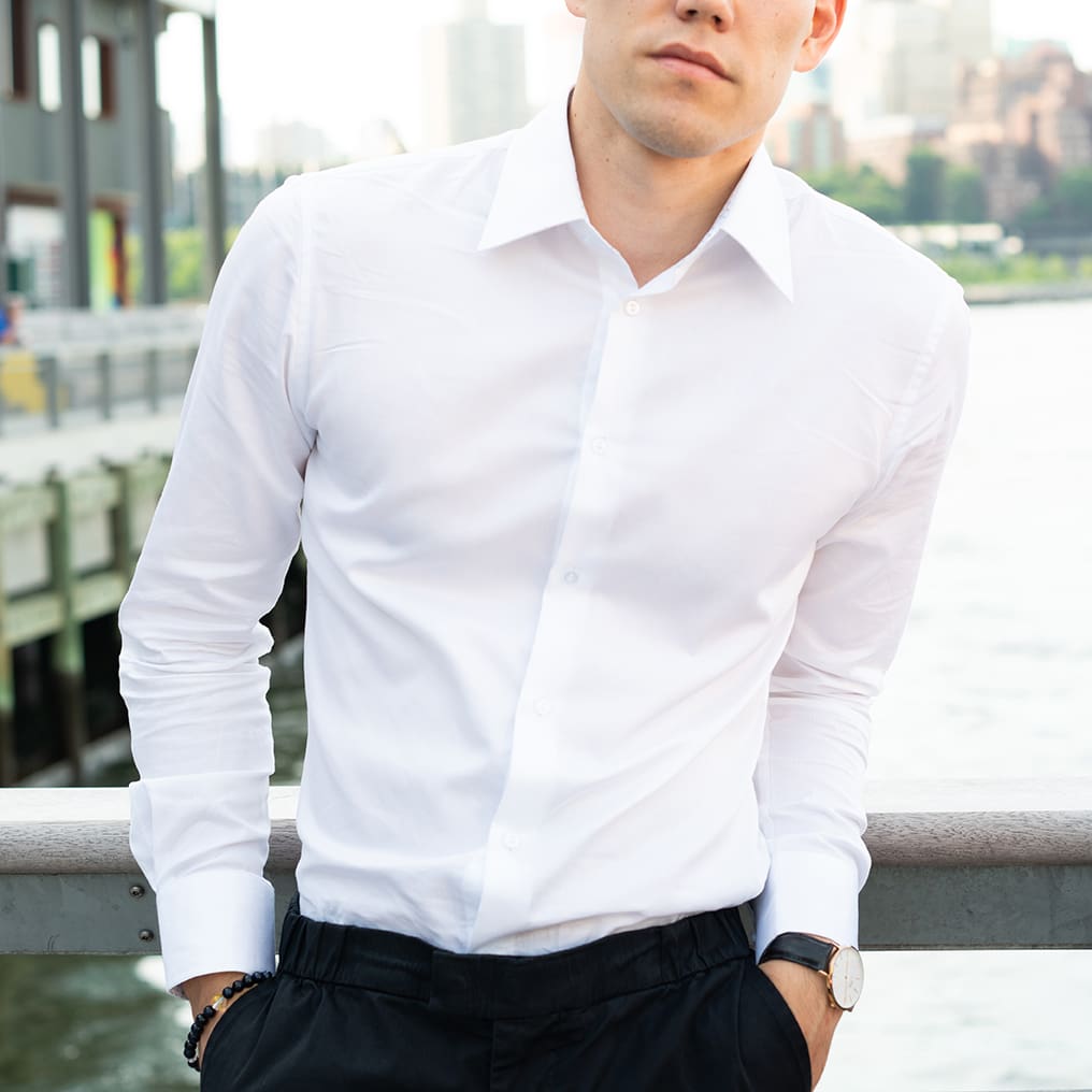 man with coffee in city wearing white button up collared dress shirt for men | Slim Fit White Collared Speckled Dress Shirt | Long Sleeve Button Up
