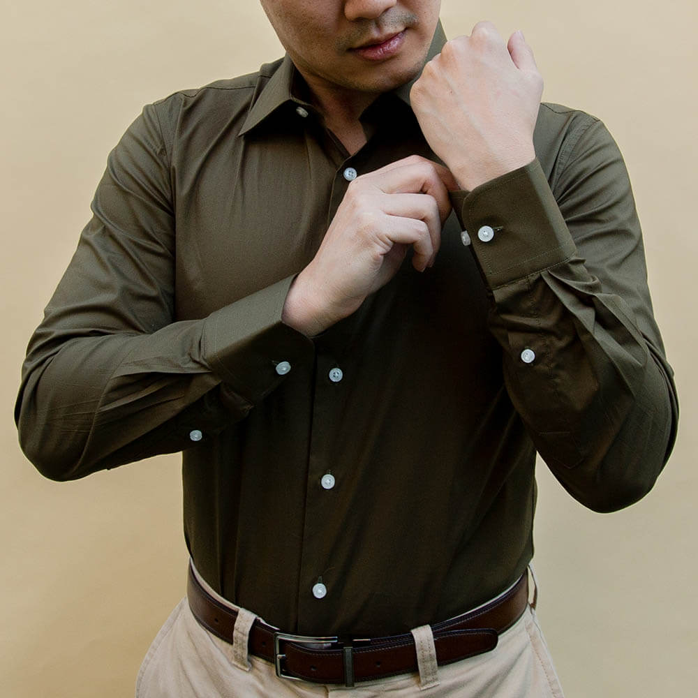 man wearing hunter green dress shirt showing cuffs