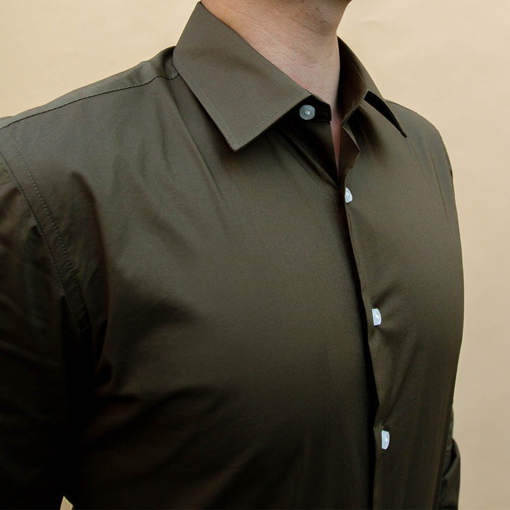 model is 5'5" and 120 lbs wearing size N1 of olive 100% cotton shirt
