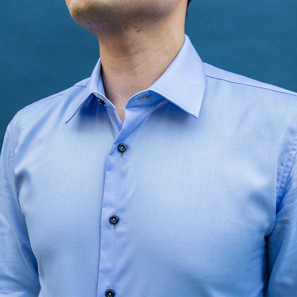 model is 5'5" 120 lbs wearing size n1 in 100% cotton light blue smooth weave slim fit