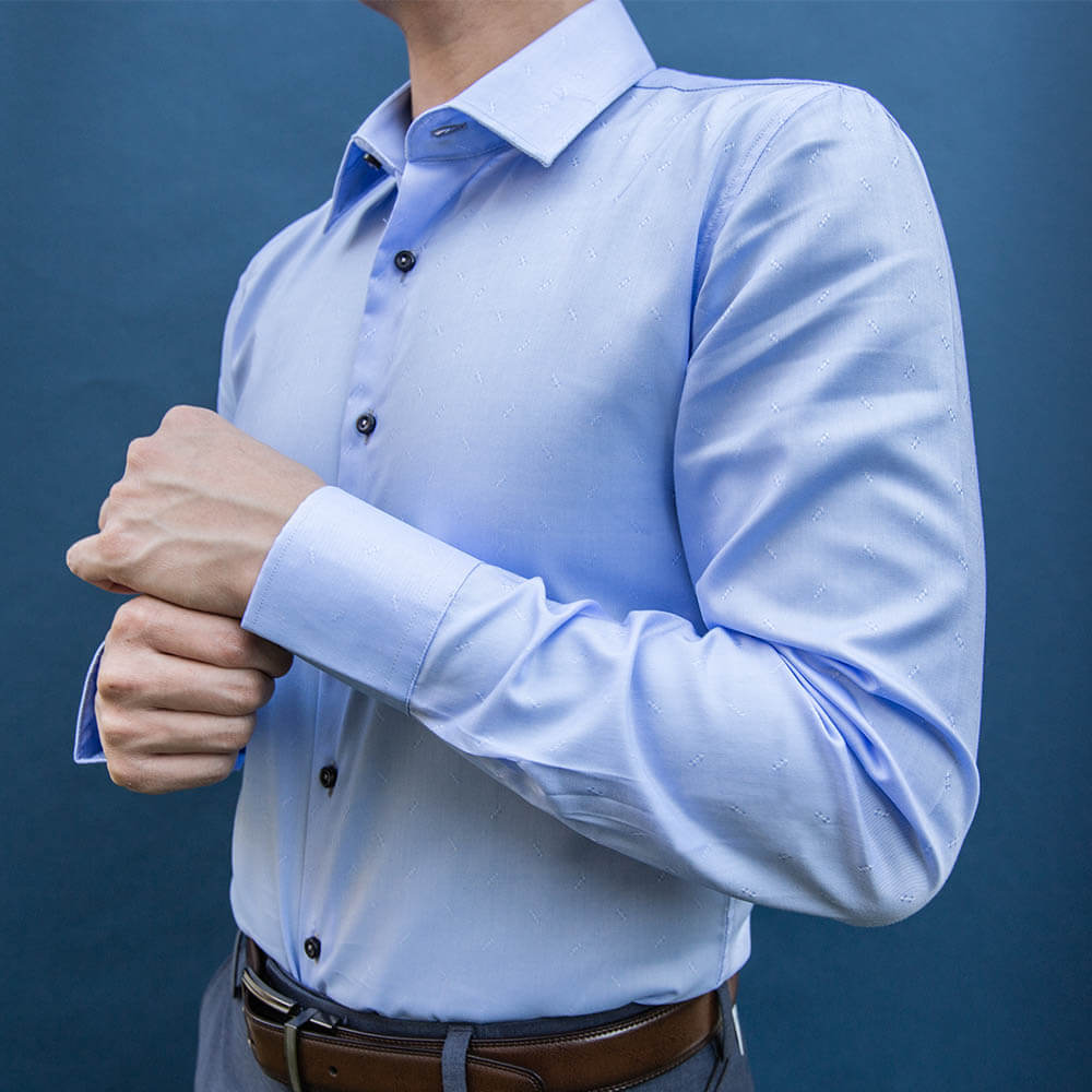 model is 5'5" 120 lbs wearing size n1 in 100% cotton light blue smooth weave slim fit