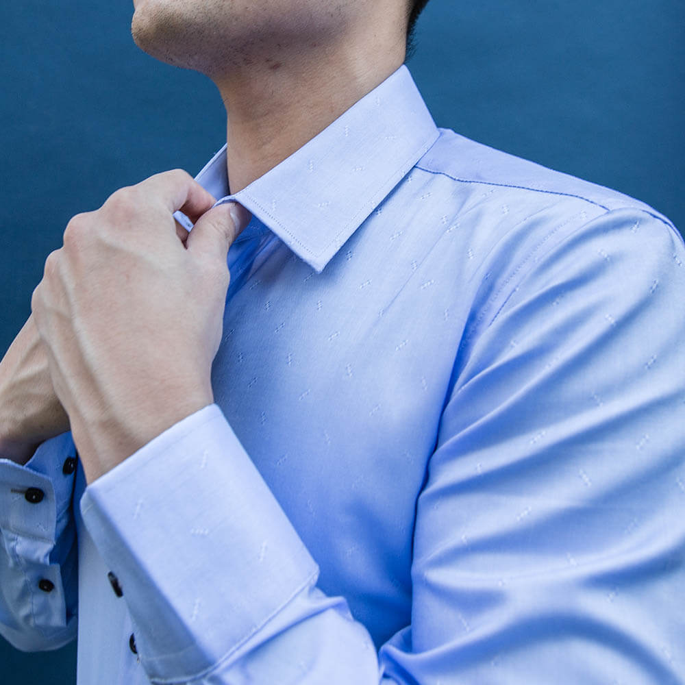 model is 5'5" 120 lbs wearing size n1 in 100% cotton light blue smooth weave slim fit