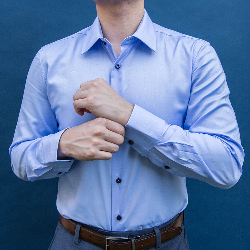 model is 5'5" 120 lbs wearing size n1 in 100% cotton light blue smooth weave slim fit