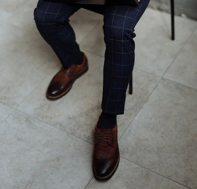 blue suit brown shoes
