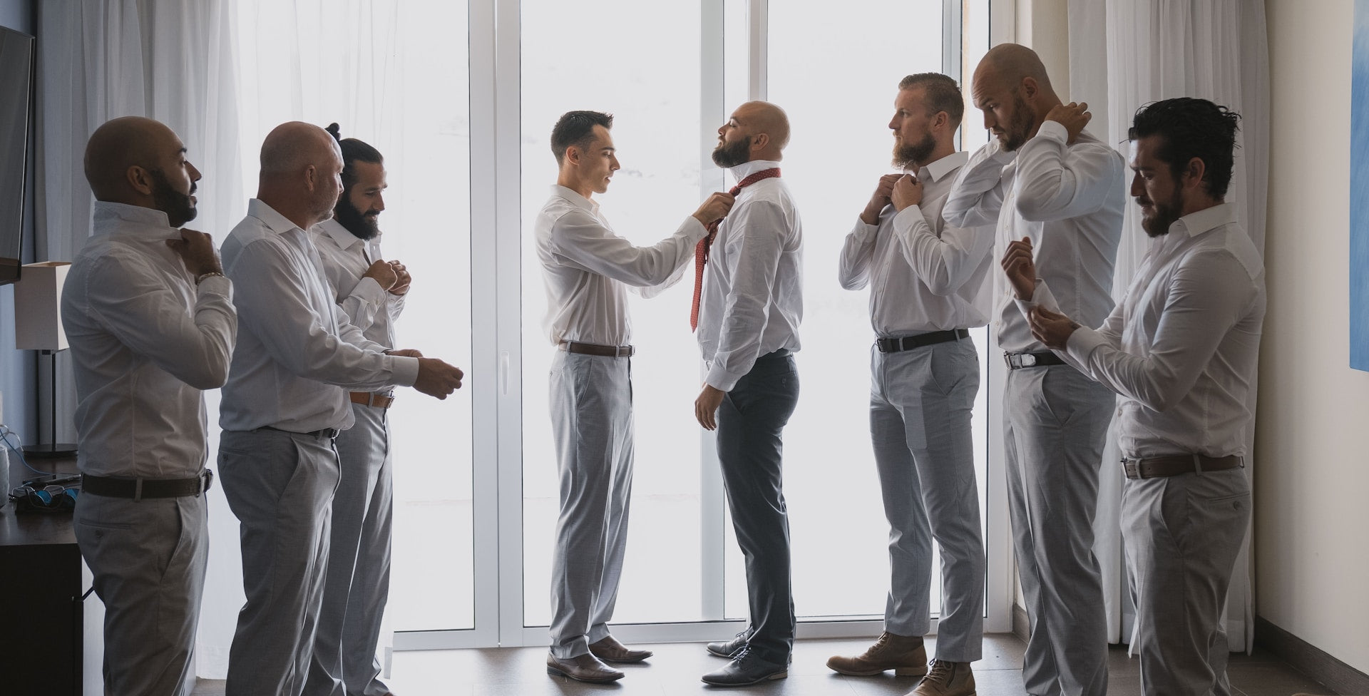 men wearing white to a wedding