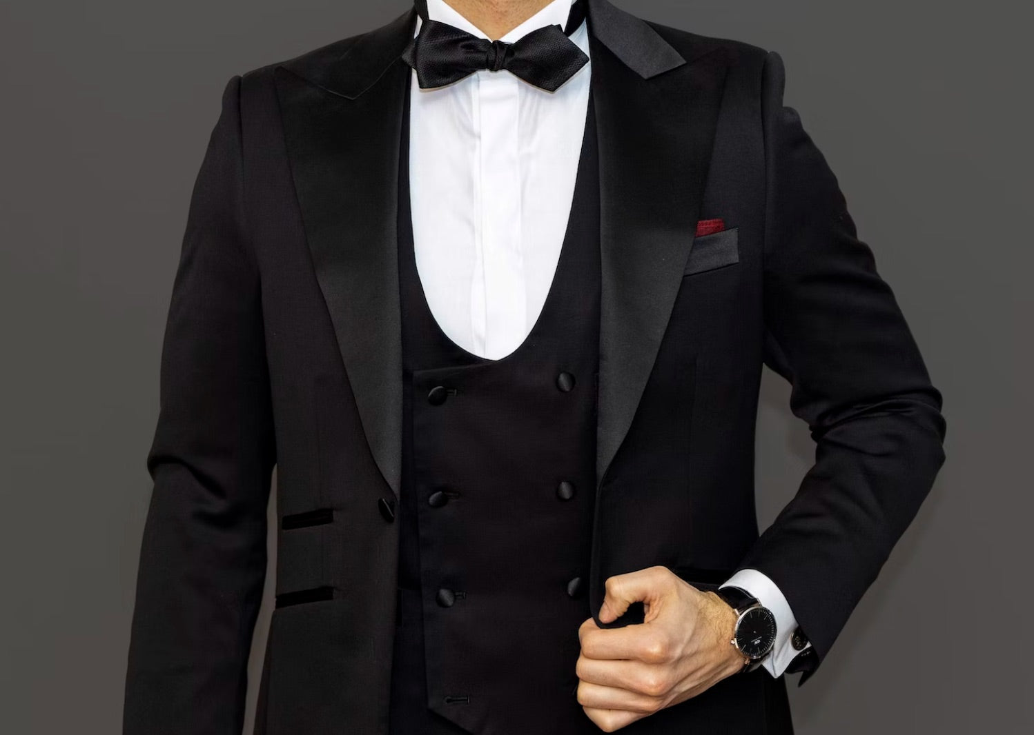 man wearing tuxedo and white dress shirt with bow tie to black tie wedding