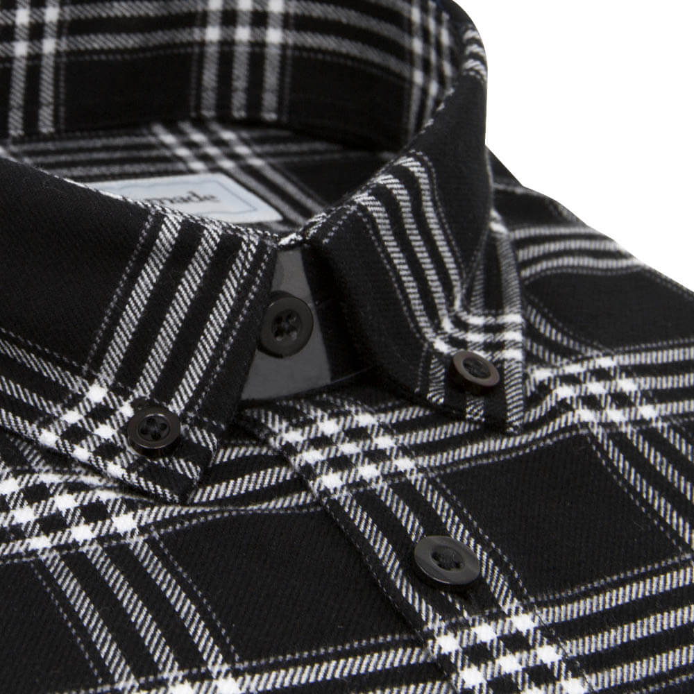 closeup on collar of black and white button down shirt