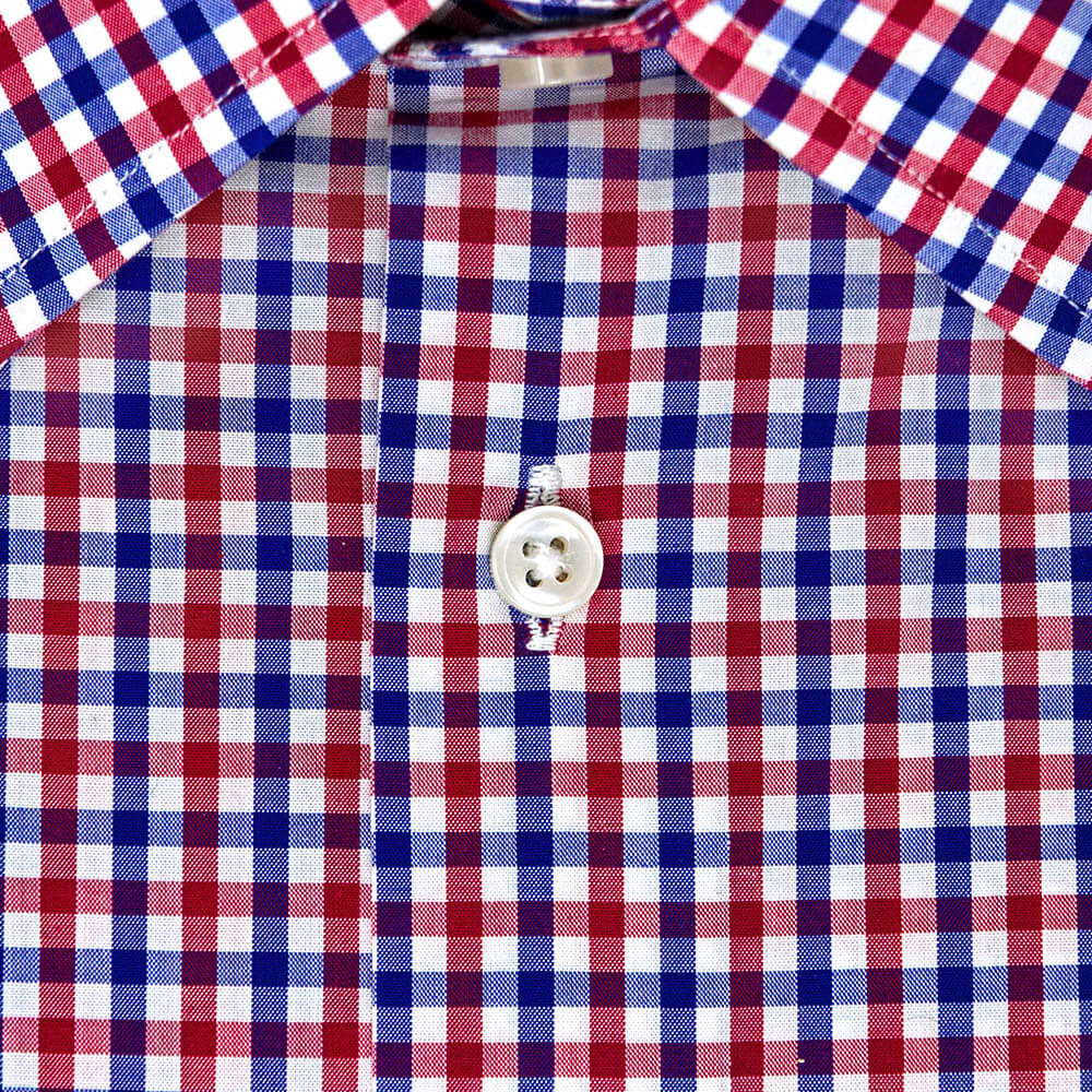 button on a red white and blue button up shirt