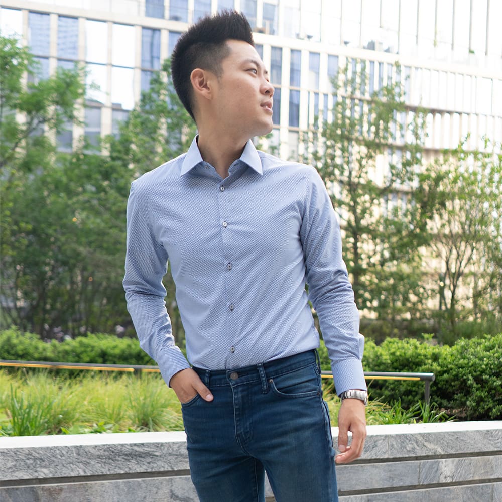 dark blue dress shirt print on man wearing jeans in city
