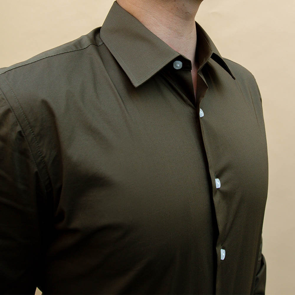 model wearing army green button up dress shirt for men