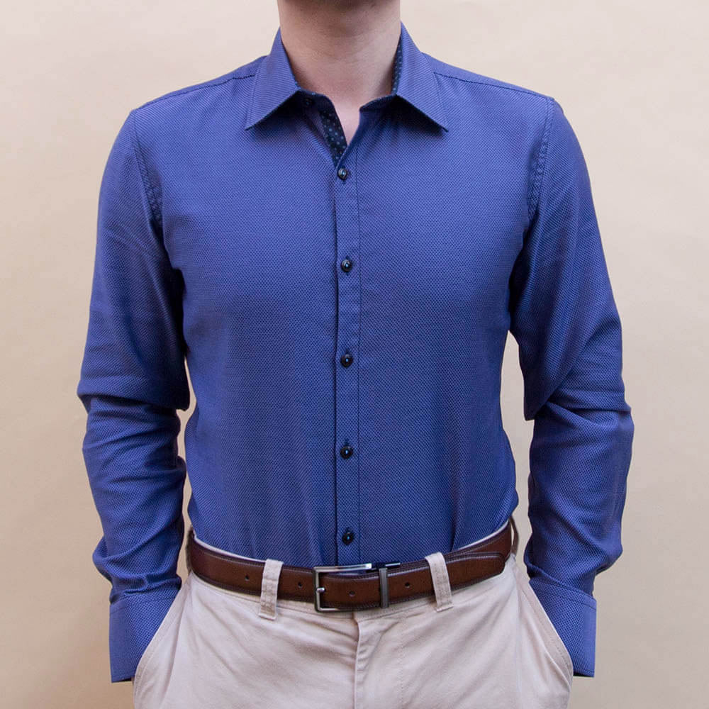 front view of model wearing deep blue dress shirt