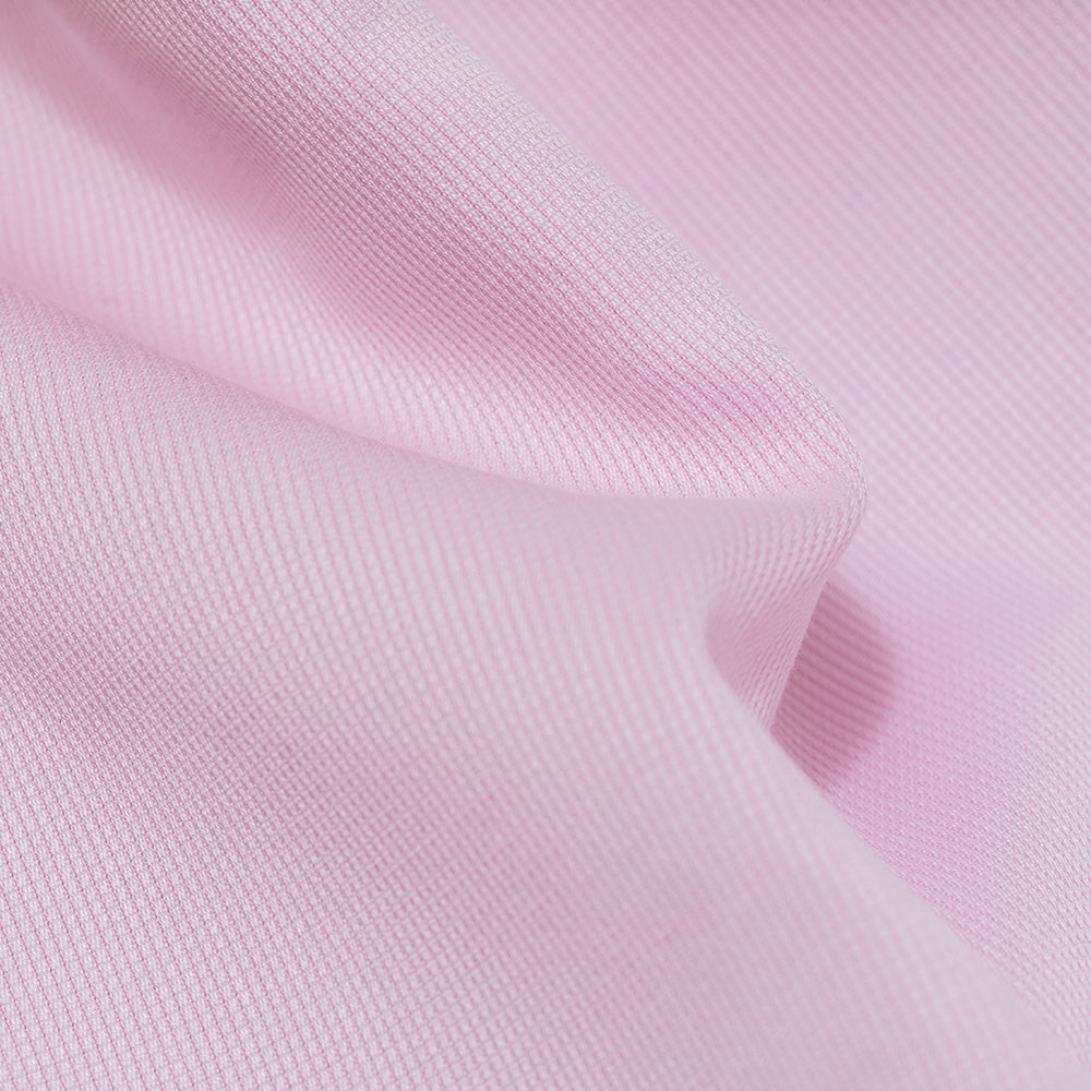 closeup of jacquard shirt weave fabric of men's slim fit pink dress shirt