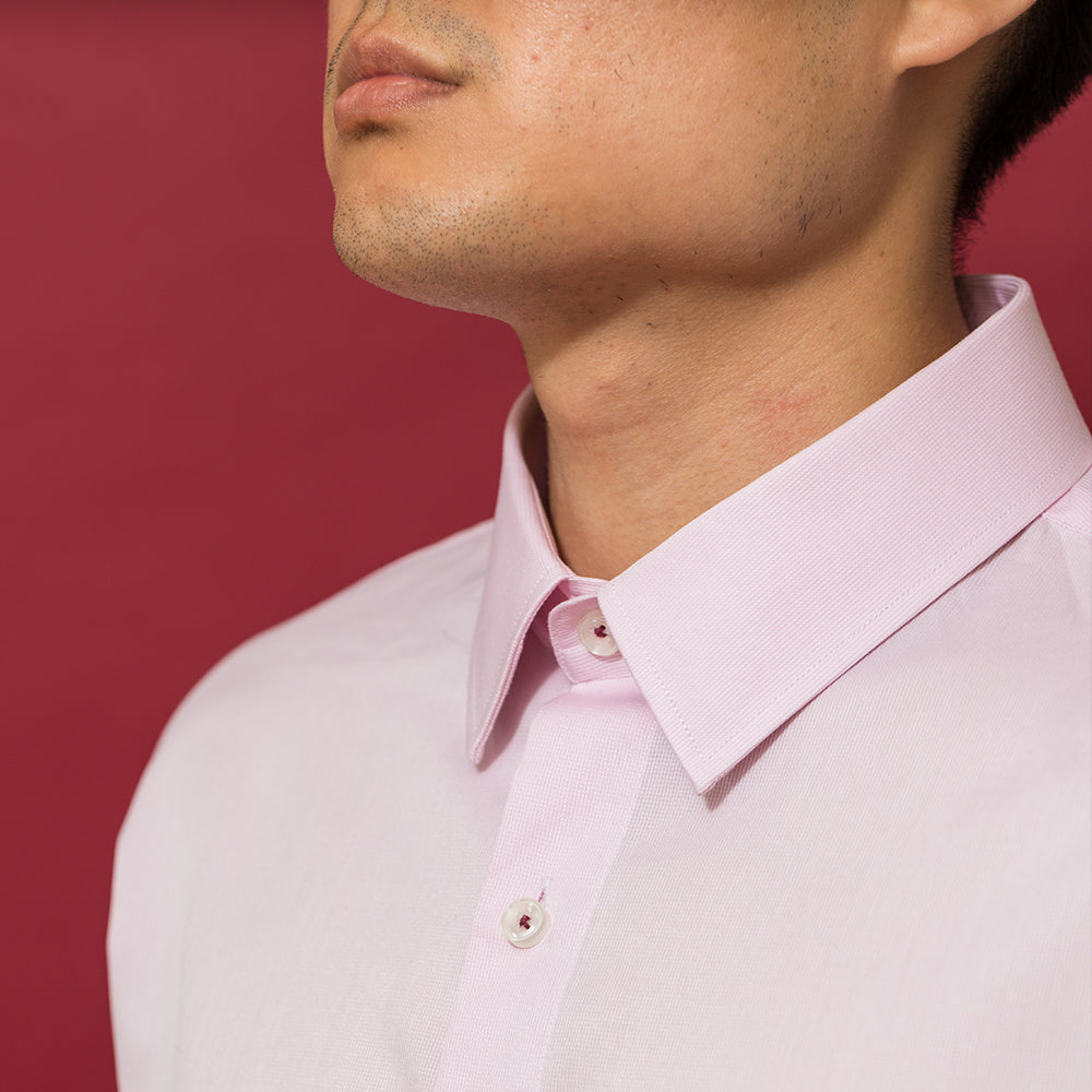 men's slim fit pink dress shirt on model on red background