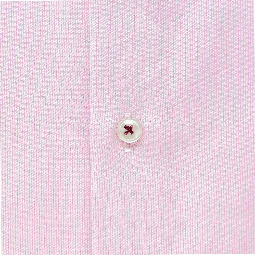pale pink dress shirt closeup of fabric and button trim details