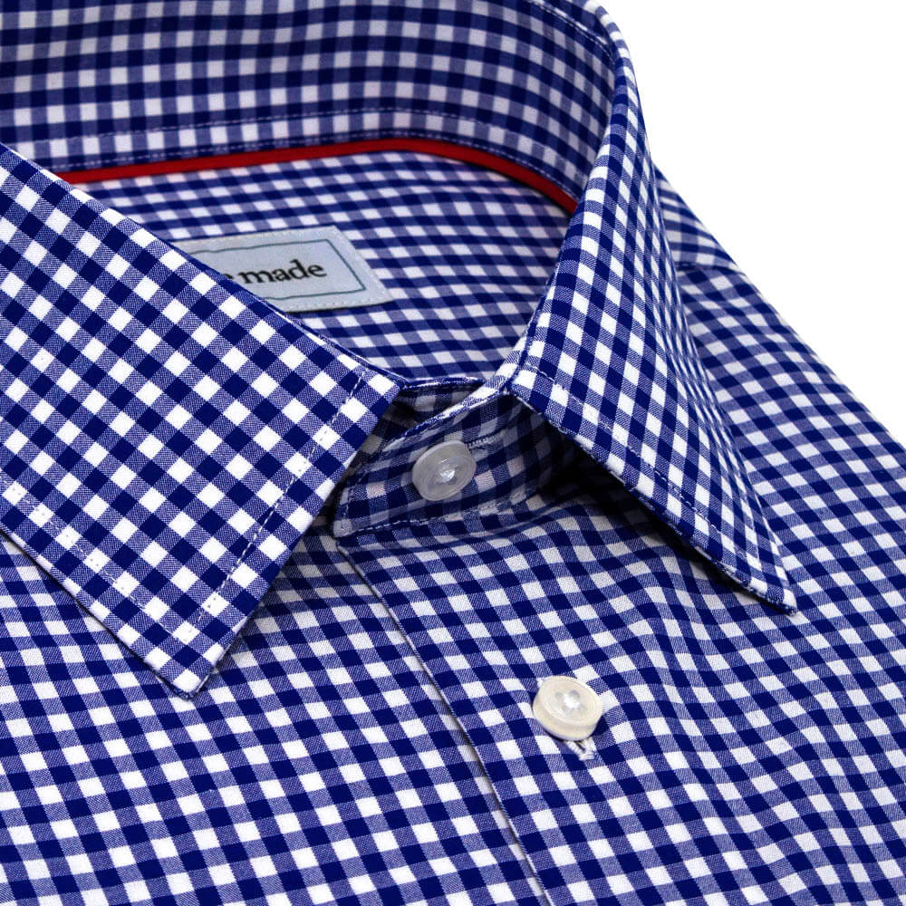 close up of collar of navy blue checkered dress shirt