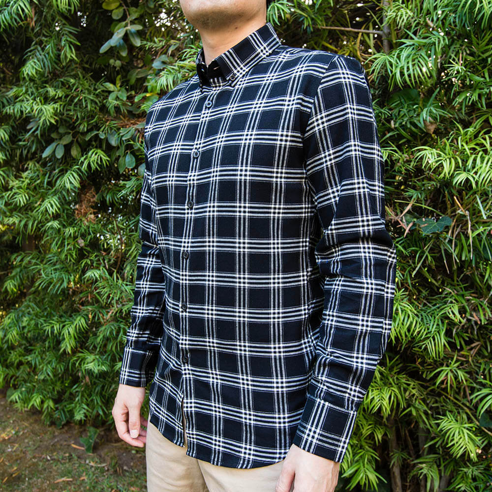 mens black and white flannel on man