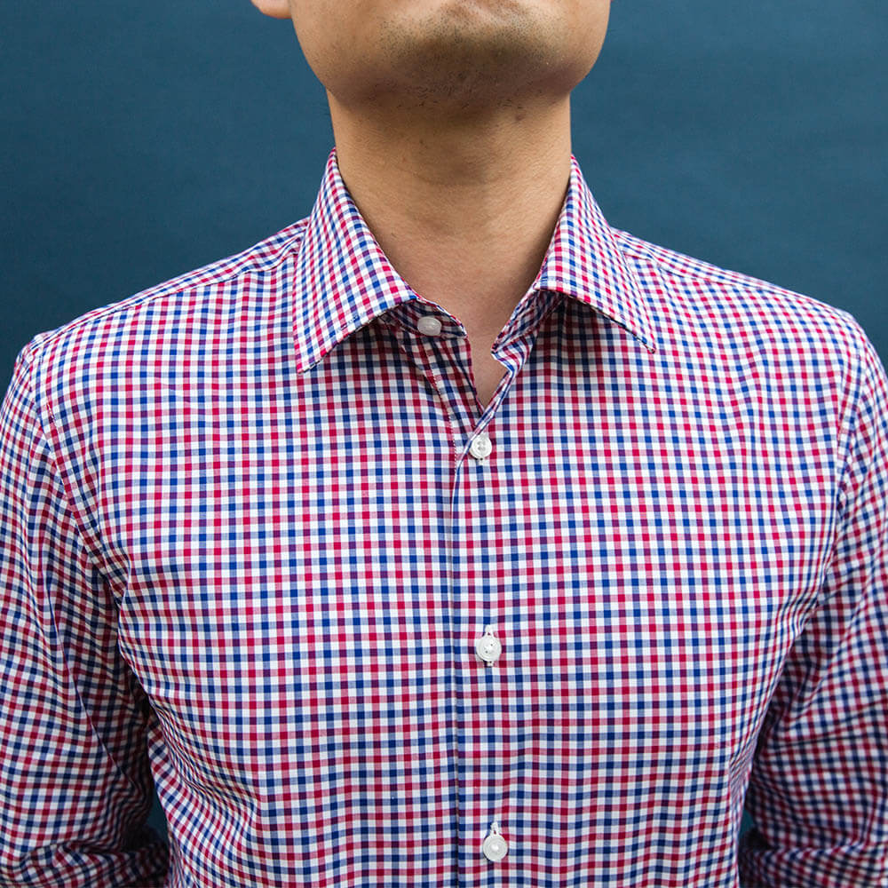 close up of collar on a red white and blue dress shirt