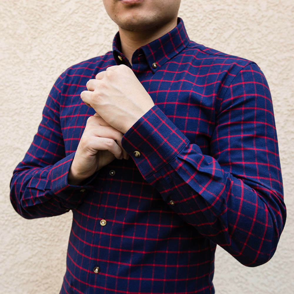 red and blue flannel shirts showcasing cuff and brown buttons