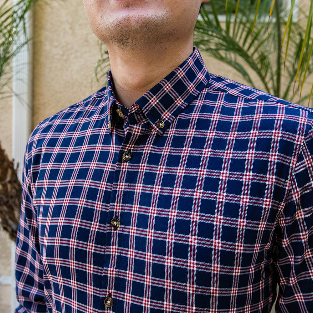 flannel dress shirt on upper torso of man